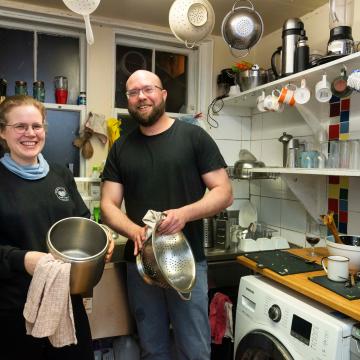 Two people washing up