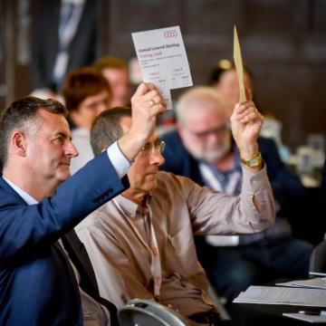 Man holding voting paper