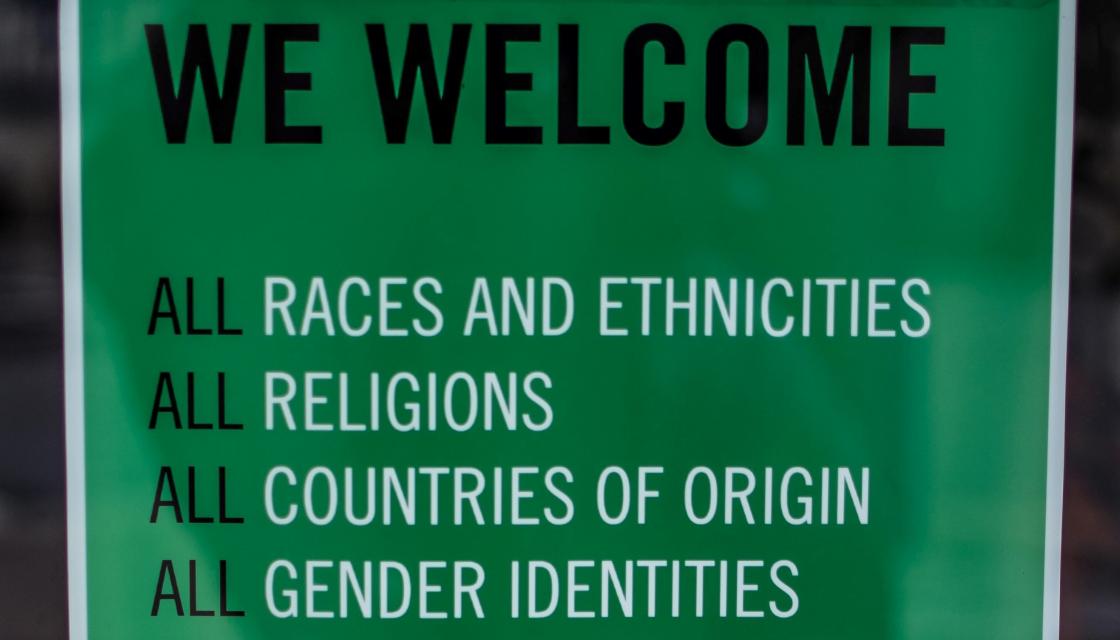 Sign  saying we welcome all races and ethnicities