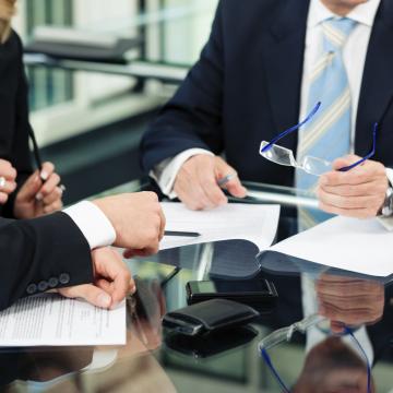 People in suits having a meeting