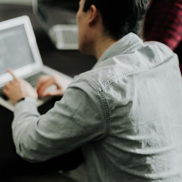 Person looking at laptop