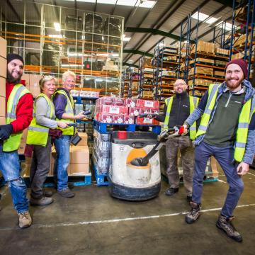 Suma's members at work in the warehouse