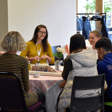 People sat around a table at the Equal Care Co-op AGM