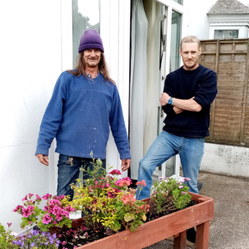 People in garden with plants